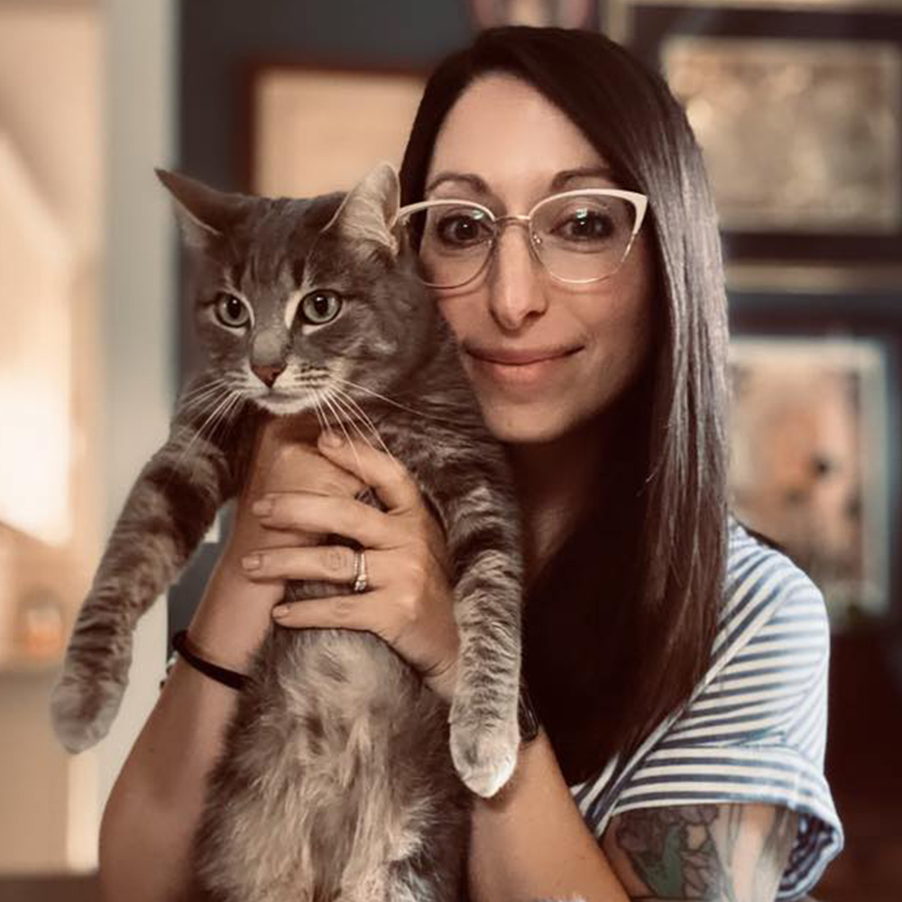 Photograph of Vivi holding a cat